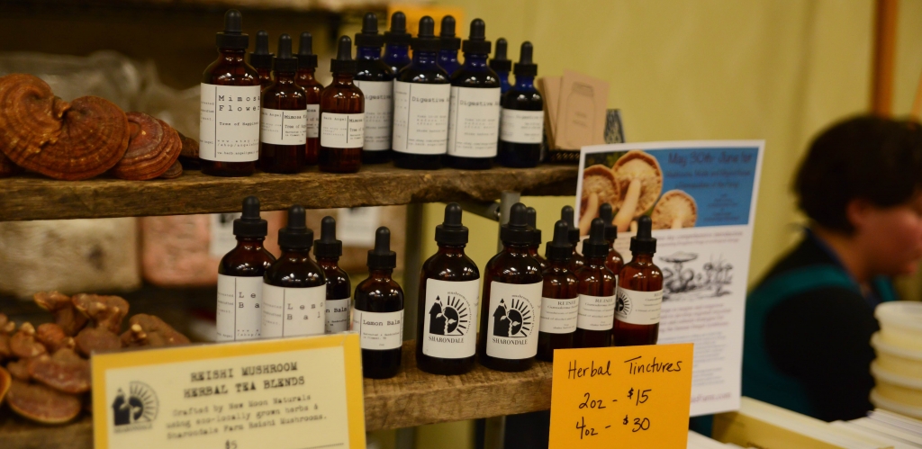 Various bottles of herbal tinctures and remedies on display.