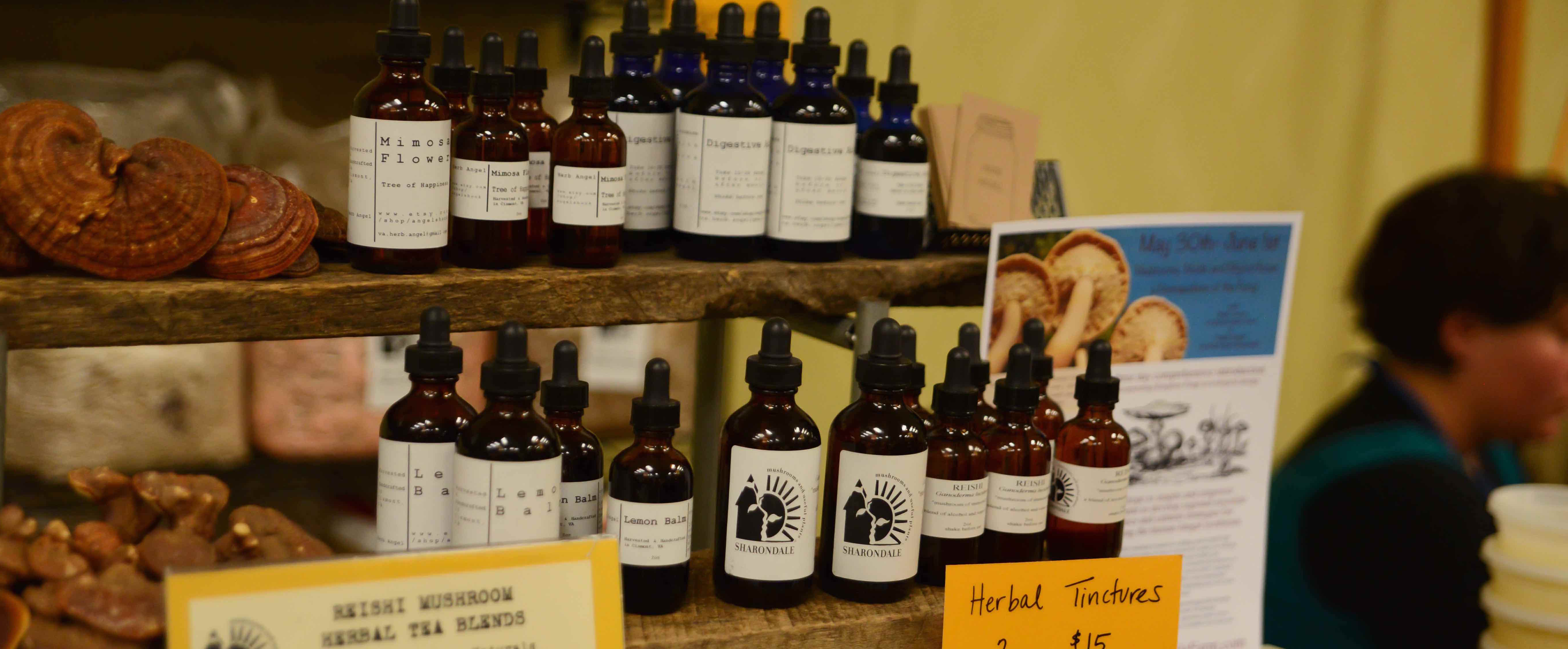 Bottles of herbal tinctures and extracts on display.